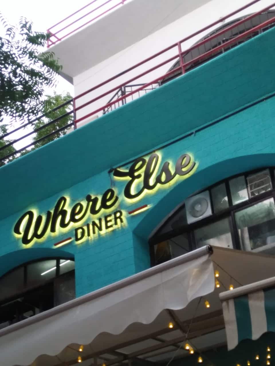 Shop name board made of ACP metal letters with a warm white colored back glow effect created by using LED modules